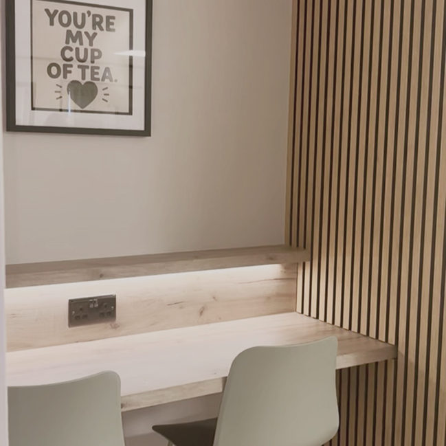A table for two in the RESET café, beside the slatted oak wall